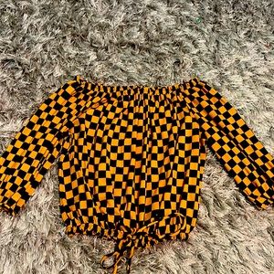 Off the shoulder, long sleeve shirt.